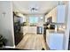 Well-lit kitchen featuring white cabinetry, stainless appliances, and elegant countertops at 1950 E Dust Devil Dr, San Tan Valley, AZ 85143