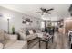 Open-concept living room flows seamlessly into the dining and kitchen areas, perfect for entertaining at 1950 E Dust Devil Dr, San Tan Valley, AZ 85143