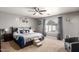Cozy main bedroom featuring a plush bed, soft carpeting, and a ceiling fan at 1950 E Dust Devil Dr, San Tan Valley, AZ 85143
