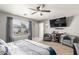 The main bedroom features a comfortable sitting area and a large window for natural light at 1950 E Dust Devil Dr, San Tan Valley, AZ 85143