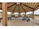 Under a covered structure this picnic area offers multiple picnic tables and charcoal grills at 1950 E Dust Devil Dr, San Tan Valley, AZ 85143