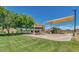Community playground with swings, slides, and climbing structures perfect for outdoor recreation and Gathering fun at 1950 E Dust Devil Dr, San Tan Valley, AZ 85143