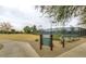 Well-maintained Recreation Center with a sign and grassy areas, perfect for community engagement and relaxation at 1950 E Dust Devil Dr, San Tan Valley, AZ 85143