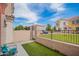 Private backyard patio featuring a cozy seating area and low-maintenance turf at 1950 N Center St # 115, Mesa, AZ 85201
