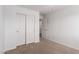 Bedroom featuring carpet, closet, ceiling fan, and an open door at 1950 N Center St # 115, Mesa, AZ 85201