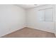 This bedroom boasts natural light and neutral carpet flooring at 1950 N Center St # 115, Mesa, AZ 85201