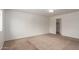 Primary bedroom featuring carpet floors and access to the walk in closet at 1950 N Center St # 115, Mesa, AZ 85201