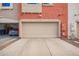 Home exterior featuring a two-car garage and neutral paint scheme at 1950 N Center St # 115, Mesa, AZ 85201