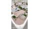 An aerial view of a home's backyard, gravel area, and fenced in outdoor space at 19814 W Buchanan St, Buckeye, AZ 85326