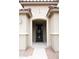 Inviting front entryway featuring an arched door frame and stylish front door at 19814 W Buchanan St, Buckeye, AZ 85326