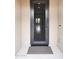 Inviting front entryway with a screened door, neutral walls, and clear view into the home at 19814 W Buchanan St, Buckeye, AZ 85326