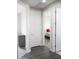 Hallway with 3 doorways and wood flooring leading to bedrooms at 19814 W Buchanan St, Buckeye, AZ 85326