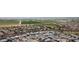 A vibrant aerial view of a neighborhood, featuring homes, streets, and green landscape at 19814 W Buchanan St, Buckeye, AZ 85326