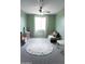 Bright playroom with soft carpet, alphabet rug, and ample space for toys and activities at 19814 W Buchanan St, Buckeye, AZ 85326