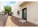 View of a gated backyard with rock landscaping and the exterior of a building at 2000 N 36Th St # 29, Phoenix, AZ 85008