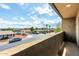 Balcony view featuring neighborhood street, landscaping, and distant mountain views on a sunny day at 2000 N 36Th St # 29, Phoenix, AZ 85008
