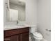 Powder room with modern fixtures, vanity, and toilet at 2000 N 36Th St # 29, Phoenix, AZ 85008