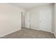 Bedroom with plush carpeting and access to an open doorway at 2000 N 36Th St # 29, Phoenix, AZ 85008
