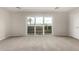 Bright bedroom features a sliding glass door offering a view and ample space at 2000 N 36Th St # 29, Phoenix, AZ 85008