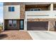 Modern two-story home with a stone facade, private balcony, and low-maintenance desert landscaping at 2000 N 36Th St # 29, Phoenix, AZ 85008