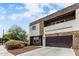 Stylish two-story home featuring a stone facade, private balcony, with desert landscaping at 2000 N 36Th St # 29, Phoenix, AZ 85008