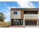 Stylish two-story home featuring a stone facade and private balcony, in a well-maintained community at 2000 N 36Th St # 29, Phoenix, AZ 85008