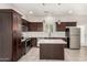 Modern kitchen with stainless appliances, center island, and plenty of storage at 2000 N 36Th St # 29, Phoenix, AZ 85008