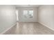 Bright living room featuring tile flooring and two windows with views of the neighborhood at 2000 N 36Th St # 29, Phoenix, AZ 85008