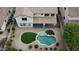 Aerial view of the house showcasing the backyard, pool, covered patio, and desert landscaping at 21472 E Saddle Ct, Queen Creek, AZ 85142
