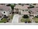Beautiful two-story house with a well-maintained lawn and landscaping in a residential neighborhood at 21472 E Saddle Ct, Queen Creek, AZ 85142