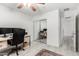 Home office features light wood floors, and mirrored closet at 21472 E Saddle Ct, Queen Creek, AZ 85142