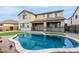 The backyard boasts a private pool area, perfect for summertime fun and relaxation at 21472 E Saddle Ct, Queen Creek, AZ 85142
