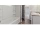 Bathroom showcases a clean white tub and shower combination with a view to the vanity at 255 W Dewey Ave, Coolidge, AZ 85128