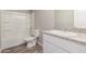 Bathroom boasts a toilet, tub-shower combination, and granite countertops at 255 W Dewey Ave, Coolidge, AZ 85128