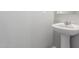 Close-up view of the bathroom sink with gray walls at 255 W Dewey Ave, Coolidge, AZ 85128
