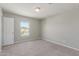 Neutral bedroom with carpet and window views of the neighborhood at 255 W Dewey Ave, Coolidge, AZ 85128