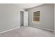 Carpeted bedroom with a standard closet and natural lighting at 255 W Dewey Ave, Coolidge, AZ 85128