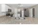 Kitchen featuring granite counters, stainless steel appliances, and white cabinets at 255 W Dewey Ave, Coolidge, AZ 85128