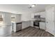 Modern kitchen featuring white cabinets, stainless steel appliances, and a peninsula with granite counters at 255 W Dewey Ave, Coolidge, AZ 85128
