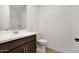 Clean bathroom with a modern vanity, large mirror, and a glass-enclosed shower at 25616 N 148Th Dr, Surprise, AZ 85387