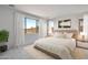 Relaxing bedroom features bright windows, neutral tones, and an ensuite bathroom at 25616 N 148Th Dr, Surprise, AZ 85387