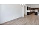 Open-concept dining area adjacent to the kitchen, with wood-look tile flooring at 25616 N 148Th Dr, Surprise, AZ 85387