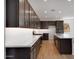 Stylish kitchen boasting dark cabinets, subway tile backsplash, and a functional center island at 25616 N 148Th Dr, Surprise, AZ 85387