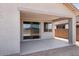 Covered outdoor patio with sliding glass doors and concrete slab, perfect for entertaining at 25616 N 148Th Dr, Surprise, AZ 85387