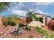 Backyard showcasing desert landscaping, a privacy wall and a covered patio area at 26145 W Runion Dr, Buckeye, AZ 85396