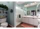 Bright bathroom with a glass-enclosed shower and double sink vanity with storage space at 26145 W Runion Dr, Buckeye, AZ 85396