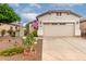 Charming single-Gathering home featuring a two-car garage and a beautifully landscaped front yard at 26145 W Runion Dr, Buckeye, AZ 85396