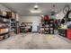Well lit garage with shelving units for storing items and a clean concrete floor at 26145 W Runion Dr, Buckeye, AZ 85396