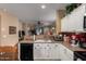 Bright kitchen with updated appliances and finishes and a passthrough to the living area at 26145 W Runion Dr, Buckeye, AZ 85396