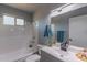 Updated bathroom with sleek vanity, tub-shower combo, and modern fixtures at 2625 N 40Th Dr, Phoenix, AZ 85009